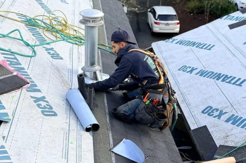 Skilled Roofing crew installing a new asphalt shingle roof in Lynnwood