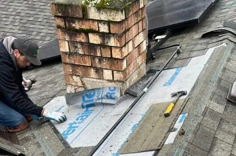 emergency roof repair in Renton WA crew stabilizing storm damage; homeowner checking roof damage safely in Renton