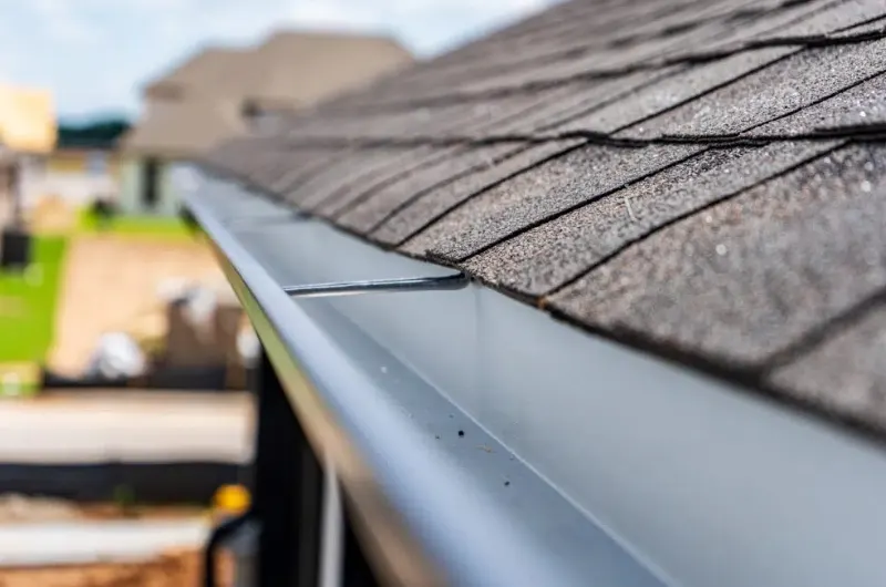 gutter installation Edmonds WA home facing Puget Sound; properly sized gutters on an Edmonds waterfront roofline; downspout installation near Edmonds WA
